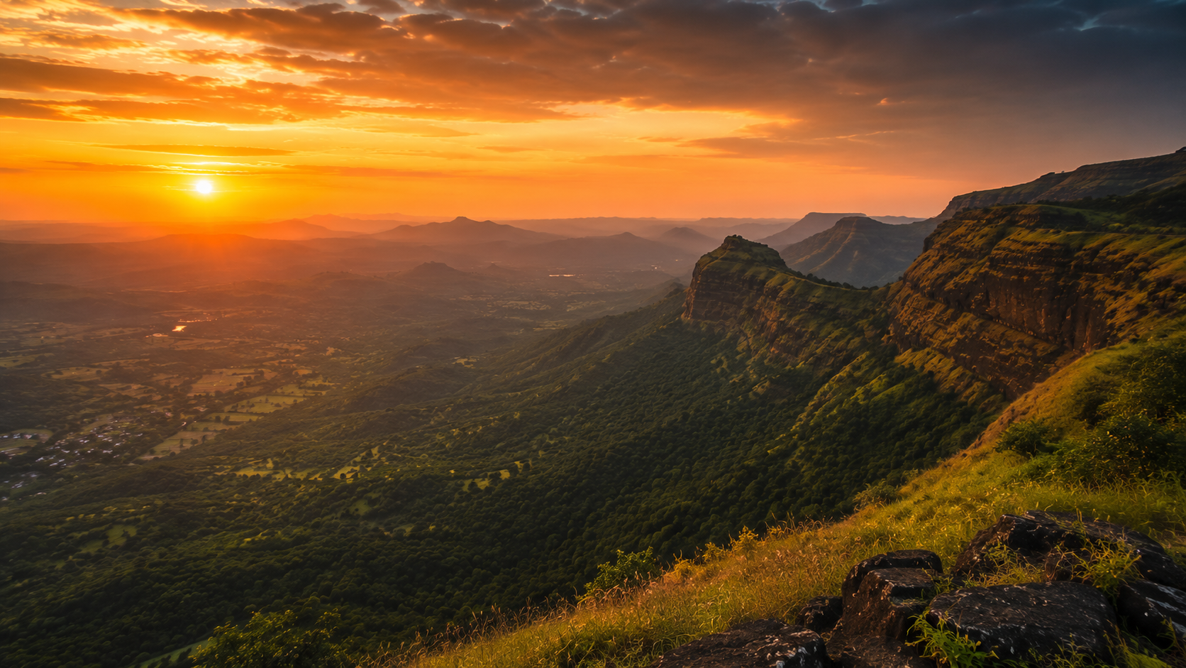 Orange sunset sky over the Konkan valley seen from Arthur's Seat viewpoint in Mahabaleshwar
