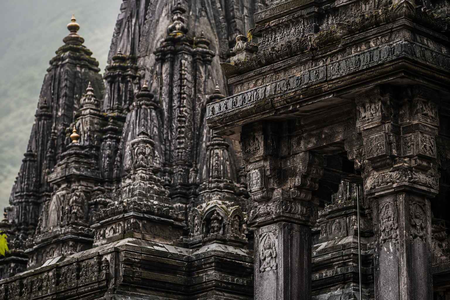 Detailed carved stone architecture and spires of the historic Trimbakeshwar Temple